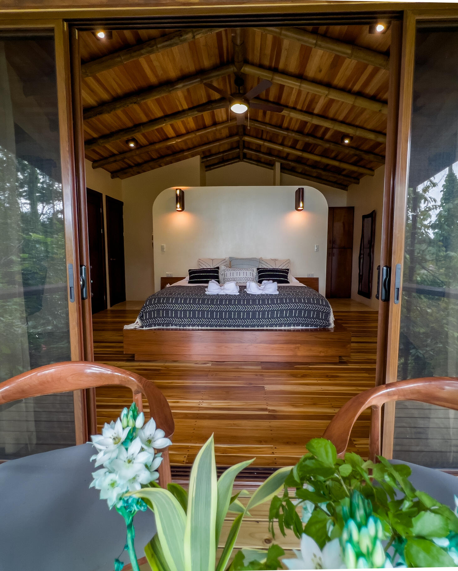 stacked rocks in a calm stream with sun beaming